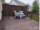 A wooden deck with table and chairs offers a private space for outdoor dining at 1764 Pipers Ridge Nw Cir, Conover, NC 28613