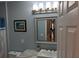 Bathroom featuring a vanity with marble countertop, with neutrally painted walls and white door and trim at 1764 Pipers Ridge Nw Cir, Conover, NC 28613