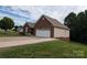 Home's exterior elevation features a side load garage and manicured lawn at 1764 Pipers Ridge Nw Cir, Conover, NC 28613