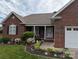 Charming single-story brick home with a well-manicured lawn and tasteful landscaping at 1764 Pipers Ridge Nw Cir, Conover, NC 28613