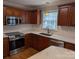 Stylish kitchen featuring stainless steel appliances, bright countertops and backsplash at 1764 Pipers Ridge Nw Cir, Conover, NC 28613