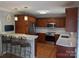 Modern kitchen with stainless steel appliances, a breakfast bar, and ample cabinet space at 1764 Pipers Ridge Nw Cir, Conover, NC 28613