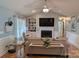 Bright living room featuring a fireplace, custom built-ins, and hardwood flooring at 1764 Pipers Ridge Nw Cir, Conover, NC 28613
