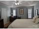 Spacious main bedroom featuring hardwood floors, a ceiling fan, and ample natural light at 1764 Pipers Ridge Nw Cir, Conover, NC 28613