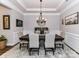 Elegant dining room with tray ceiling, chandelier, and a large table perfect for Gathering gatherings at 2005 Arbor Hills Dr, Indian Trail, NC 28079