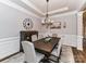 Elegant dining room with tray ceiling, chandelier, and a large table perfect for Gathering gatherings at 2005 Arbor Hills Dr, Indian Trail, NC 28079
