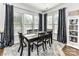 Dining area features neutral decor, hardwood flooring, and natural light from a large window at 2005 Arbor Hills Dr, Indian Trail, NC 28079