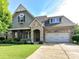 Charming brick and stone home with a well-manicured lawn and inviting front entrance at 2005 Arbor Hills Dr, Indian Trail, NC 28079