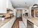 Updated kitchen boasts stainless steel appliances, granite counters, and tile backsplash at 2005 Arbor Hills Dr, Indian Trail, NC 28079