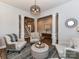 Comfortable living room featuring neutral tones, stylish furnishings, and view to the staircase at 2005 Arbor Hills Dr, Indian Trail, NC 28079