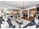 Open concept living room with kitchen and dining area views features columns, and hardwood flooring at 2005 Arbor Hills Dr, Indian Trail, NC 28079