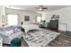 Bright main bedroom featuring a large rug, a comfortable seating area, and a well-lit home office space at 2005 Arbor Hills Dr, Indian Trail, NC 28079