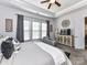 This bedroom offers a ceiling fan, sitting area, and decorative wall art accents at 2005 Arbor Hills Dr, Indian Trail, NC 28079