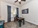 This home office offers a desk, chair, and neutral colored walls at 2005 Arbor Hills Dr, Indian Trail, NC 28079
