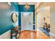 Inviting foyer with hardwood floors, a stylish light fixture, and a view into the dining room at 225 Northchase Dr, Concord, NC 28027