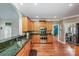 Kitchen features stainless appliances, wooden cabinets and hardwood flooring at 225 Northchase Dr, Concord, NC 28027