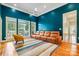 Comfortable living room with hardwood floors, a ceiling fan, and backyard views at 225 Northchase Dr, Concord, NC 28027