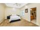 Spacious main bedroom with tray ceilings, carpet flooring, and an adjoining bathroom at 225 Northchase Dr, Concord, NC 28027