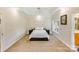 Large main bedroom featuring tray ceilings, neutral paint, and carpeted flooring at 225 Northchase Dr, Concord, NC 28027