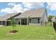 A well-maintained backyard features lush grass, a covered patio, and a privacy fence at 3022 Trace Meadow Ct, York, SC 29745