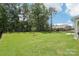 A beautiful backyard with lush lawn, tall trees, and a black fence offers a private outdoor space at 3022 Trace Meadow Ct, York, SC 29745