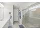 Tiled bathroom featuring a walk-in shower with a glass door and modern fixtures at 3022 Trace Meadow Ct, York, SC 29745