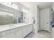 Bathroom featuring double sinks, large mirror, and access to a tiled walk-in shower at 3022 Trace Meadow Ct, York, SC 29745