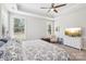 Bright bedroom featuring a tray ceiling, a ceiling fan, and natural lighting from two windows at 3022 Trace Meadow Ct, York, SC 29745