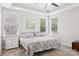 Comfortable bedroom with a tray ceiling, ceiling fan, and bright natural lighting from two windows at 3022 Trace Meadow Ct, York, SC 29745