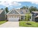 Charming home with a well-manicured lawn, three-car garage, and a blend of brick and siding accents at 3022 Trace Meadow Ct, York, SC 29745