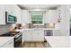 The kitchen features white cabinets, a decorative backsplash, and stainless steel appliances at 3022 Trace Meadow Ct, York, SC 29745