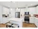 The modern kitchen includes white cabinets, stainless steel appliances, and an island with seating at 3022 Trace Meadow Ct, York, SC 29745