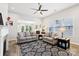 Spacious living room with lots of natural light, a decorative ceiling fan, and modern furniture at 3022 Trace Meadow Ct, York, SC 29745
