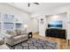 Bright living space showcasing natural light, contemporary furnishings, and a sleek entertainment setup at 3022 Trace Meadow Ct, York, SC 29745