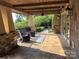Relaxing outdoor patio with stone flooring, comfortable seating, and scenic views at 3022 Trace Meadow Ct, York, SC 29745