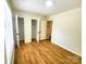 Bedroom with wood floors and a double door closet at 3106 Faircroft Way, Monroe, NC 28110