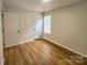The bedroom has neutral walls, wood-look flooring, and closet at 3106 Faircroft Way, Monroe, NC 28110