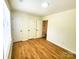 Bedroom with hardwood floors and multiple closets at 3106 Faircroft Way, Monroe, NC 28110