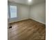 This room features wood flooring and a bright window at 3106 Faircroft Way, Monroe, NC 28110