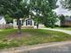 A well maintained front yard with lush green grass and mature trees, enhancing the home's curb appeal at 3106 Faircroft Way, Monroe, NC 28110
