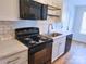 Well-equipped kitchen featuring modern appliances, sleek countertops, and ample cabinet space for storage at 3106 Faircroft Way, Monroe, NC 28110