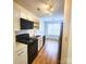 Efficient kitchen layout featuring modern appliances, sleek countertops, and bright overhead lighting at 3106 Faircroft Way, Monroe, NC 28110