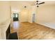 Bright living room featuring a fireplace, ceiling fan, and wood-look floors that continue throughout the home at 3106 Faircroft Way, Monroe, NC 28110