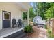 Relaxing back porch with outdoor seating and a hot tub overlooking the yard at 319 Catawba Ave, Rock Hill, SC 29730