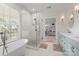 Luxurious bathroom features a modern tub, glass-enclosed shower, and double vanities at 319 Catawba Ave, Rock Hill, SC 29730