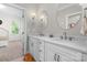 Well-lit bathroom featuring double sinks, modern fixtures, and a step stool at 319 Catawba Ave, Rock Hill, SC 29730