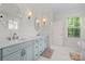Bright bathroom with double sinks, elegant fixtures, and a large window at 319 Catawba Ave, Rock Hill, SC 29730