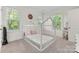 Bright bedroom featuring natural light, a unique house frame bed, and neutral tones at 319 Catawba Ave, Rock Hill, SC 29730