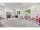 Spacious carpeted bonus room with natural light, a fireplace, and ample play space at 319 Catawba Ave, Rock Hill, SC 29730