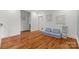 Bright bonus room with hardwood floors and blue upholstered seating for relaxation at 319 Catawba Ave, Rock Hill, SC 29730